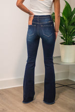 Load image into Gallery viewer, The 'Bare Necessities' High Rise pair of jeans should be a staple in every girls' closet this season. With Bootcut "flare" pants coming back, this is the perfect pair! The dark wash is slimming and the high rise is perfect for every girl. You won't wanna miss out on these!