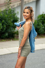 Load image into Gallery viewer, Our Caught in Motion Ribbed Tank Dress is the Perfect dress for a day running errands! We decided to pair this dress with a denim jacket, white sneakers and some gold accessories for a casual day look. The fabric is so soft, and the length is just right! With its adjustable tied straps and stretchy fabric, this dress will be perfect for any body type!