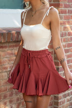 Load image into Gallery viewer, The perfect skort to transition into fall. With its cozy color and flirty ruffles, you can dress this piece up or down. We think the dainty details of our 'Pure Conifdence' bodysuit compliments the skort perfectly; just add some sneakers and you are ready!