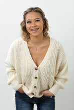Load image into Gallery viewer, This open knit button down off-white sweater is so unique and perfect for any ocassion! Wear it like our model Melody as a top, or unbutton the sweater and use it as a layering piece to keep you warm this winter. The styling options are truly endless!