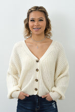 Load image into Gallery viewer, This open knit button down off-white sweater is so unique and perfect for any ocassion! Wear it like our model Melody as a top, or unbutton the sweater and use it as a layering piece to keep you warm this winter. The styling options are truly endless!