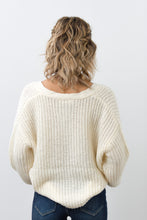 Load image into Gallery viewer, This open knit button down off-white sweater is so unique and perfect for any ocassion! Wear it like our model Melody as a top, or unbutton the sweater and use it as a layering piece to keep you warm this winter. The styling options are truly endless!