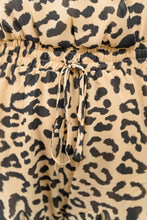 Load image into Gallery viewer, Fun. Flirty. Flowy. FABULOUSLY FLATTERING on any body type. Try pairing our Rocking Cheetah Surplice Romper with a pair of Black Booties and a Black Wide Brim Hat for the Perfect Fall Fit'.