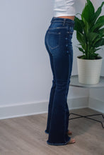 Load image into Gallery viewer, The 'Bare Necessities' High Rise pair of jeans should be a staple in every girls' closet this season. With Bootcut "flare" pants coming back, this is the perfect pair! The dark wash is slimming and the high rise is perfect for every girl. You won't wanna miss out on these!