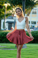 Load image into Gallery viewer, The perfect skort to transition into fall. With its cozy color and flirty ruffles, you can dress this piece up or down. We think the dainty details of our &#39;Pure Conifdence&#39; bodysuit compliments the skort perfectly; just add some sneakers and you are ready!
