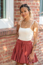 Load image into Gallery viewer, The perfect skort to transition into fall. With its cozy color and flirty ruffles, you can dress this piece up or down. We think the dainty details of our &#39;Pure Conifdence&#39; bodysuit compliments the skort perfectly; just add some sneakers and you are ready!
