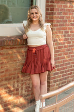 Load image into Gallery viewer, The perfect skort to transition into fall. With its cozy color and flirty ruffles, you can dress this piece up or down. We think the dainty details of our &#39;Pure Conifdence&#39; bodysuit compliments the skort perfectly; just add some sneakers and you are ready!
