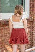 Load image into Gallery viewer, The perfect skort to transition into fall. With its cozy color and flirty ruffles, you can dress this piece up or down. We think the dainty details of our &#39;Pure Conifdence&#39; bodysuit compliments the skort perfectly; just add some sneakers and you are ready!
