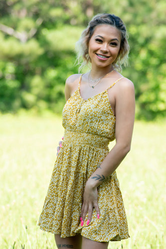 You won't want to miss out on the perfect sunday brunch dress! We think with it's smocked waist band and key-hole detail, this dainty dress wil look great on anyone. Throw on a cute denim jacket, belt, blue-turquoise accessories, and a pair of cowgirl boots for an adorable western look; or add a white cardigan and a pair of white sandels! This dress is a summer must have.
