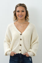 Load image into Gallery viewer, This open knit button down off-white sweater is so unique and perfect for any ocassion! Wear it like our model Melody as a top, or unbutton the sweater and use it as a layering piece to keep you warm this winter. The styling options are truly endless!
