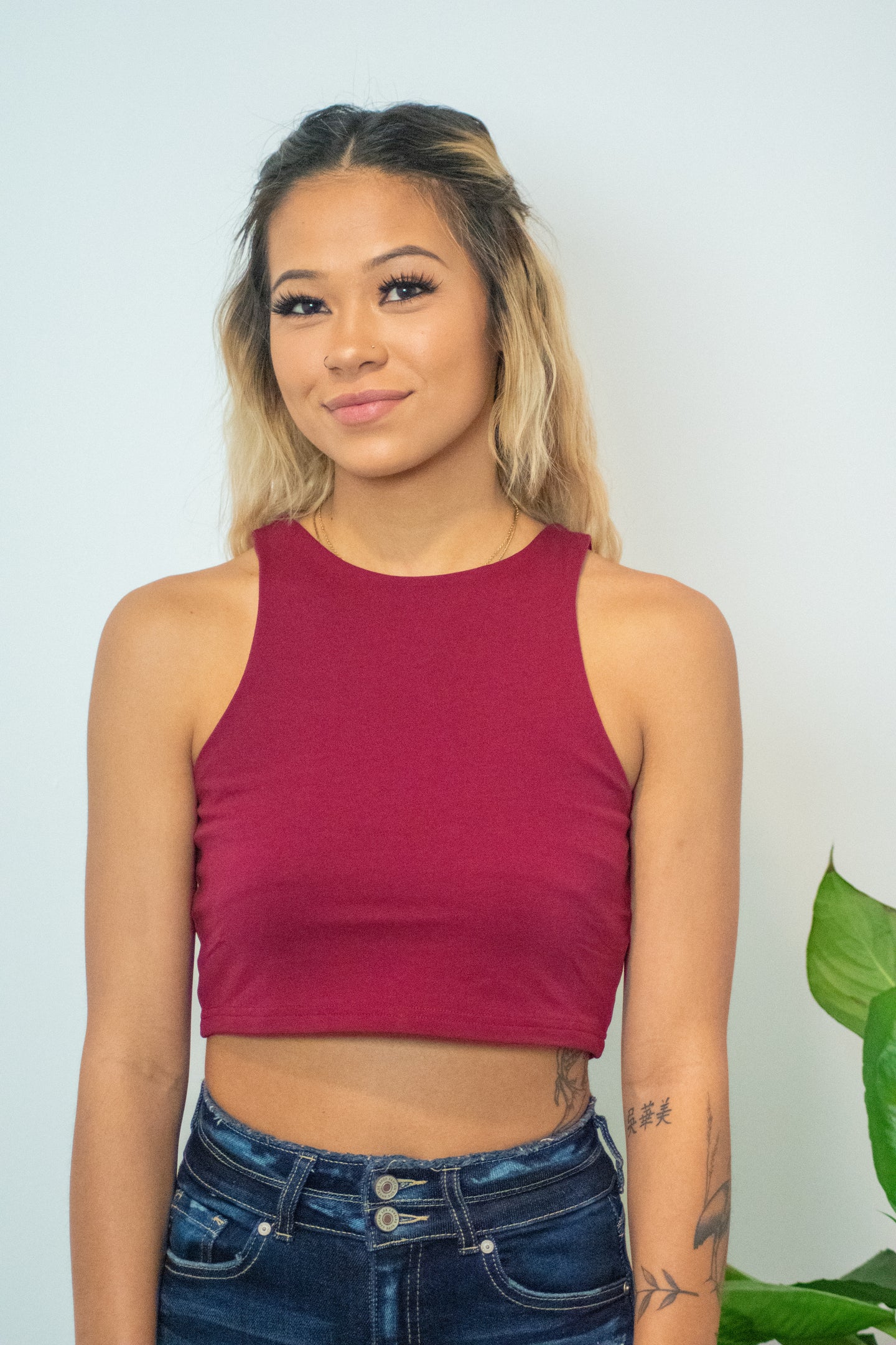 This Halter Neck Stretch Knit Racerback Crop Top is a must have item because you'll wear it with everything!