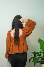 Load image into Gallery viewer, You don&#39;t want to miss out on the perfect top for the holidays! This top is sure to be a staple for the fall season and the textured swiss dots add a little extra spice! For a casual look, pair our Pure Memory top with some black denim, black botties, boho hat and you will be sure to get all of the compliments!
