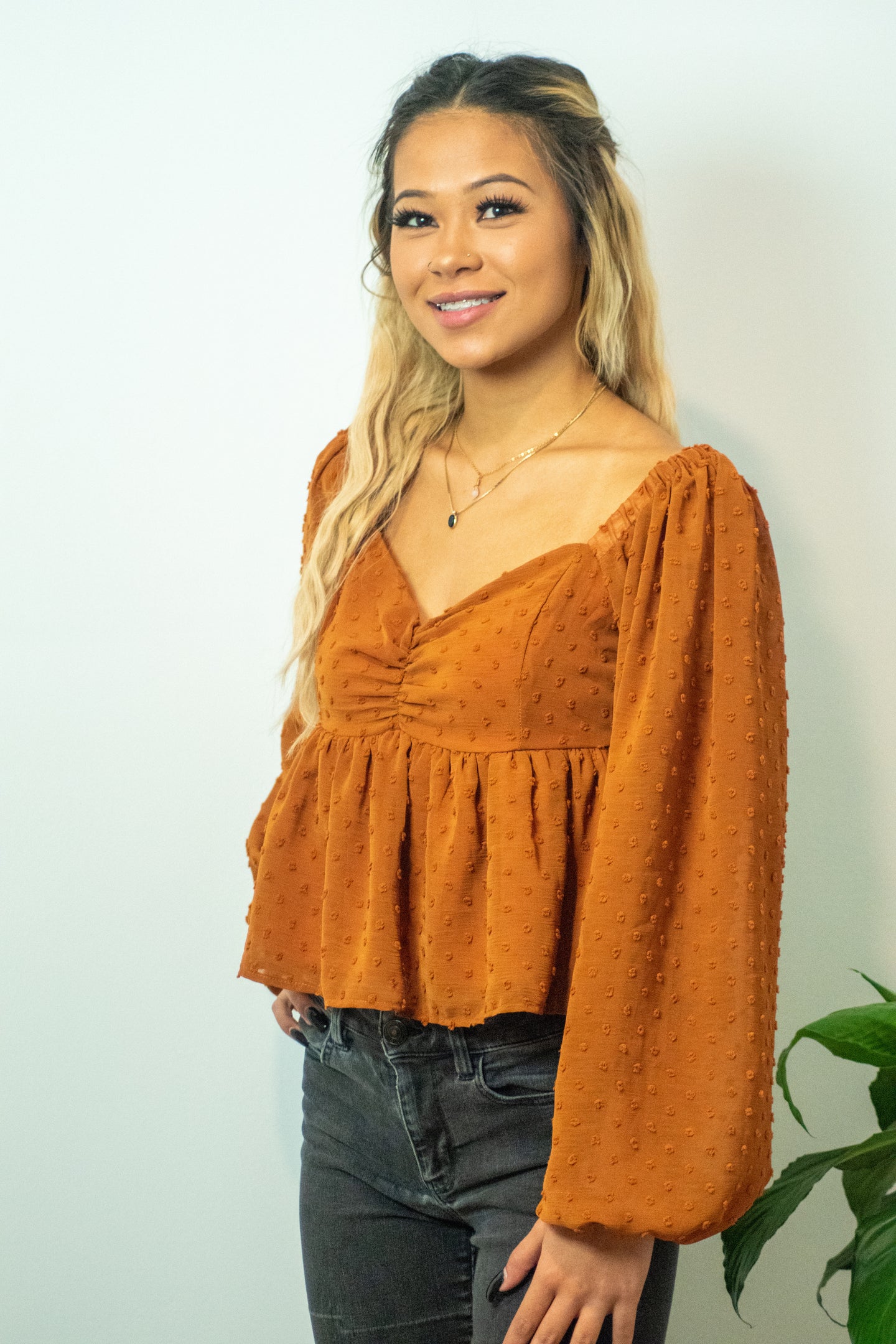 You don't want to miss out on the perfect top for the holidays! This top is sure to be a staple for the fall season and the textured swiss dots add a little extra spice! For a casual look, pair our Pure Memory top with some black denim, black botties, boho hat and you will be sure to get all of the compliments!