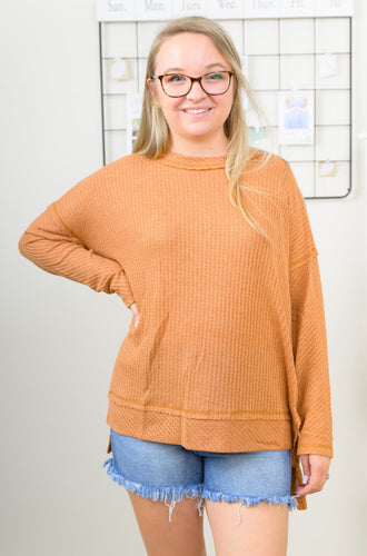 Our She's A Keeper Waffle Knit Long Sleeve Top is the Perfect Top to Elevate any T-Shirt and jeans Outfit. It's Ginger color is the perfect shade to wear in fall and keep you cute and cozy!