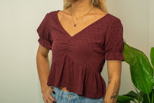 Load image into Gallery viewer, You&#39;re sure to love this wine colored baby doll top! There are so many dainty details to love! Match this top with a pair of black skinny jeans and black booties for an edgy look that is sure to turn heads!
