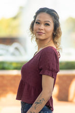 Load image into Gallery viewer, You&#39;re sure to love this wine colored baby doll top! There are so many dainty details to love! Match this top with a pair of black skinny jeans and black booties for an edgy look that is sure to turn heads!

