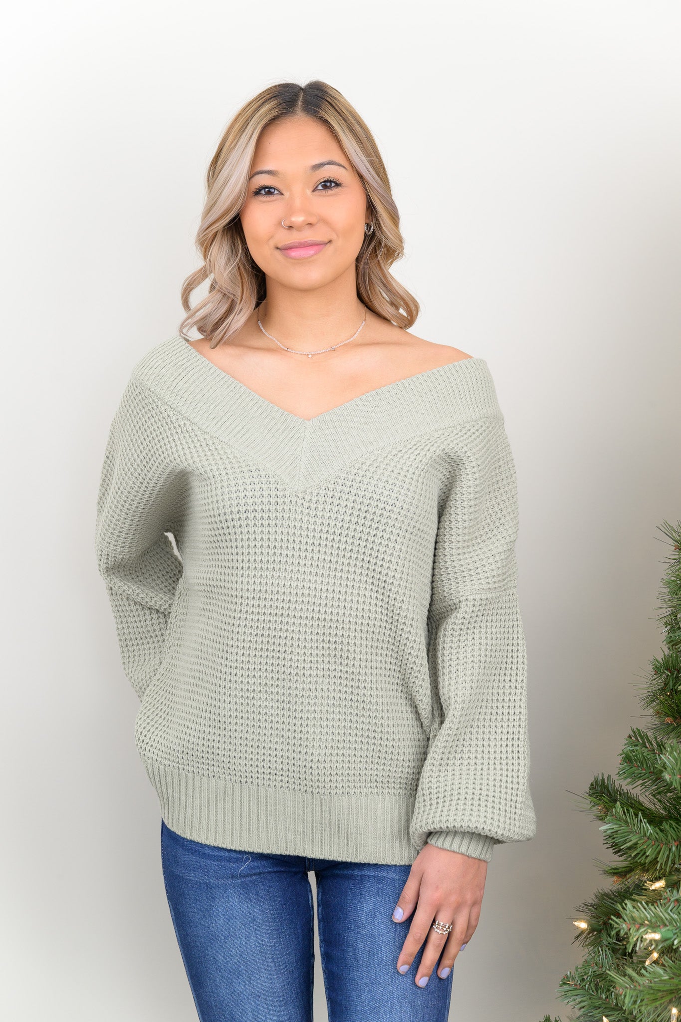 Our Love and Adored Sweater is the perfect casual top for every day wear. It features a deep V-neckline for off the shoulder wear, and a chunky knit material to keep you warm all winter long!